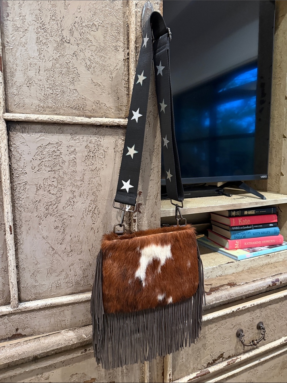 Brown and White Haircalf Fringe Crossbody Bag with Star-Print Strap
